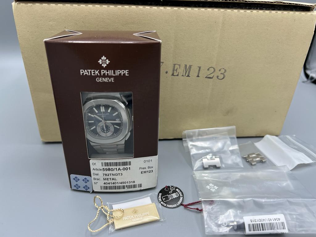 Patek Philippe Ref 5980/1A-001 Nautilus, Single Owner Watch, Full Set, Rare & Mint